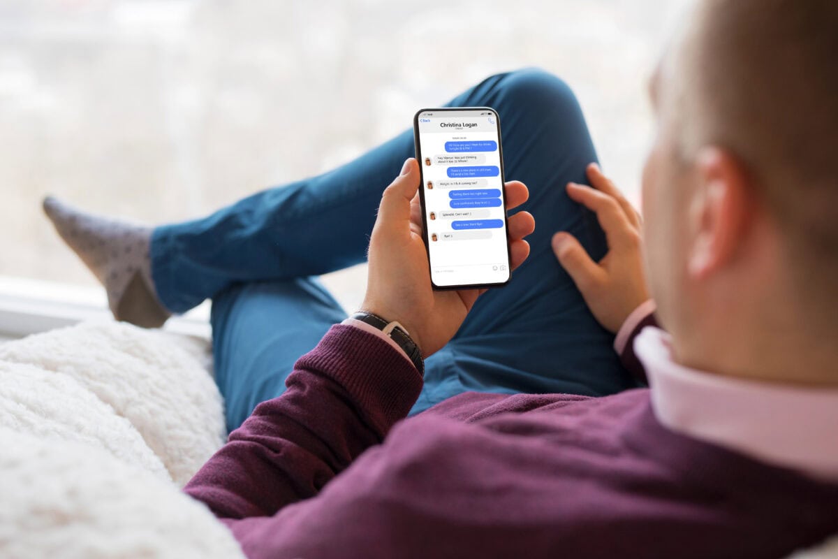 Man using messaging app on phone