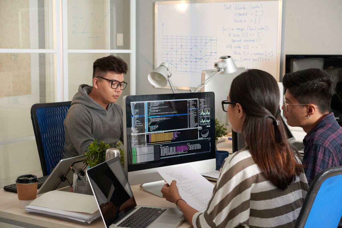 Young Woman Checking Programming Code